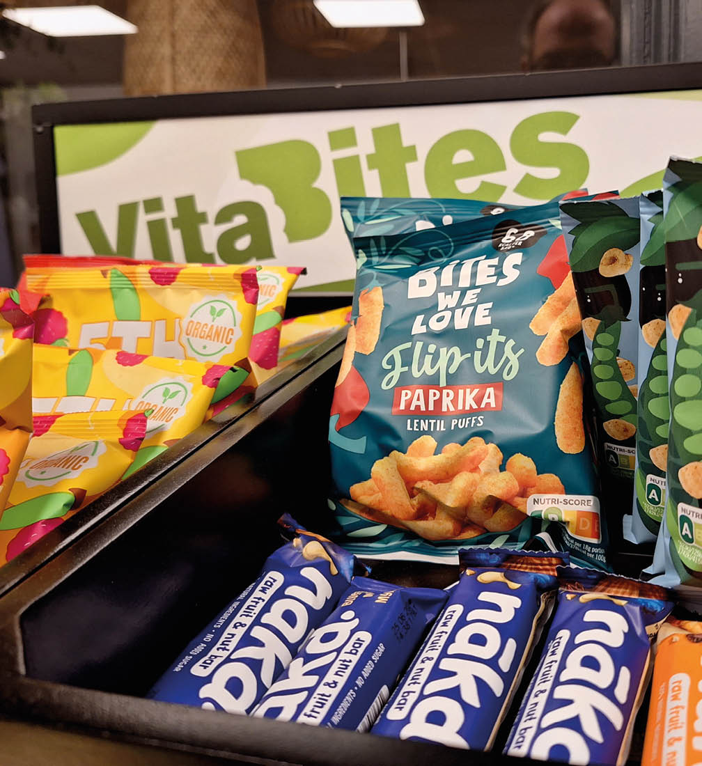 A display of snacks and chips, including a bag of chips and a bag of nuts. AI generated content