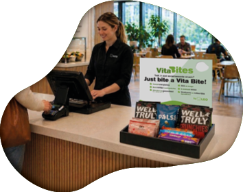 A woman is ordering food at a restaurant counter. AI generated content