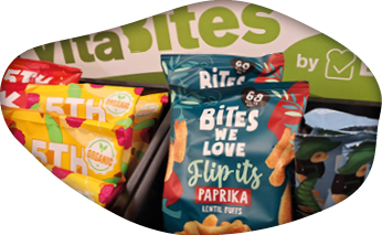 A display of snacks including chips, fruit, and nuts. AI generated content