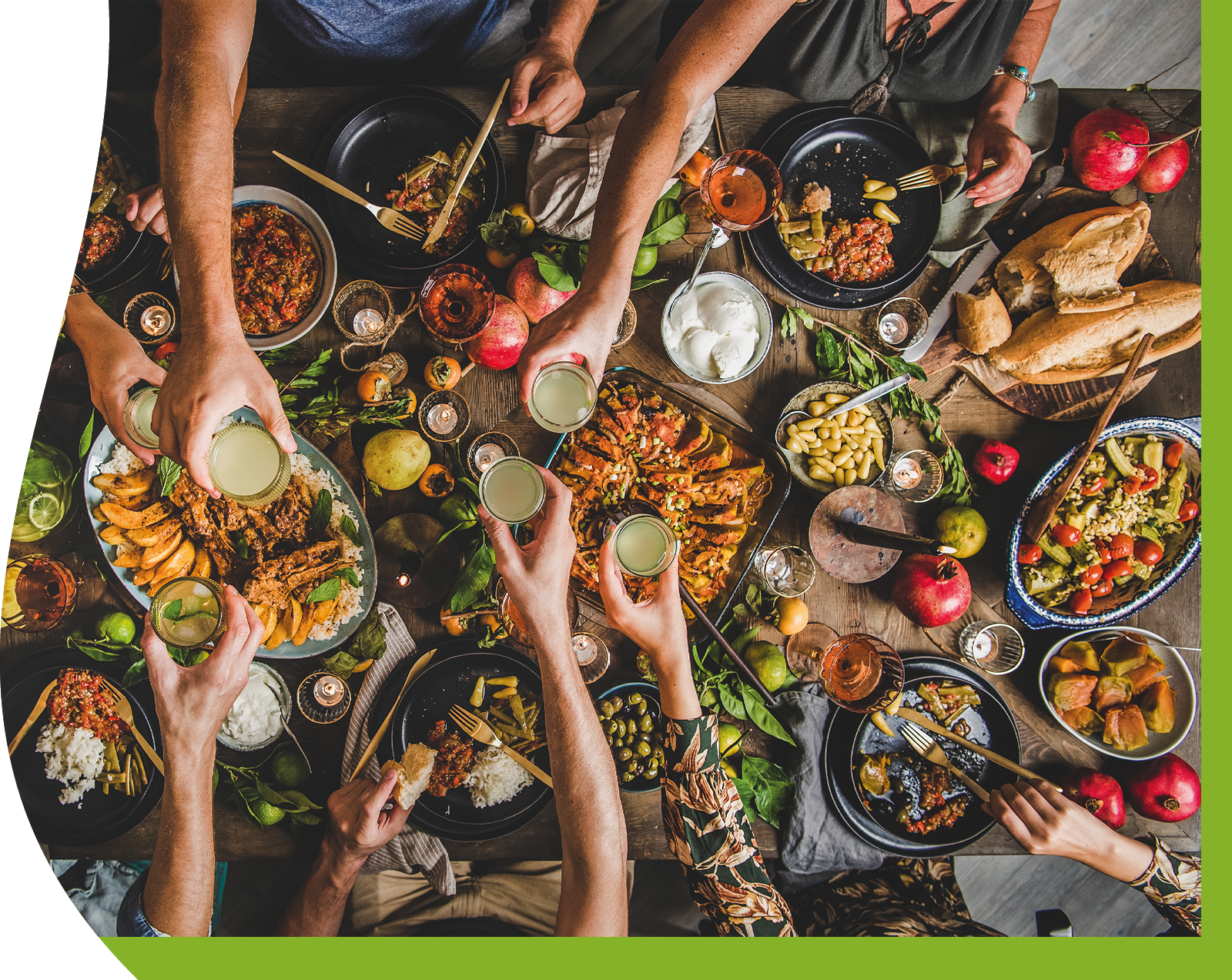 Flat-lay of family clinking glasses over rustic table with Turkish cuisine lamb chops, quince, green bean, vegetable salad, babaganush, rice pilav, pumpkin dessert, lemonade, top view. Middle East cuisine