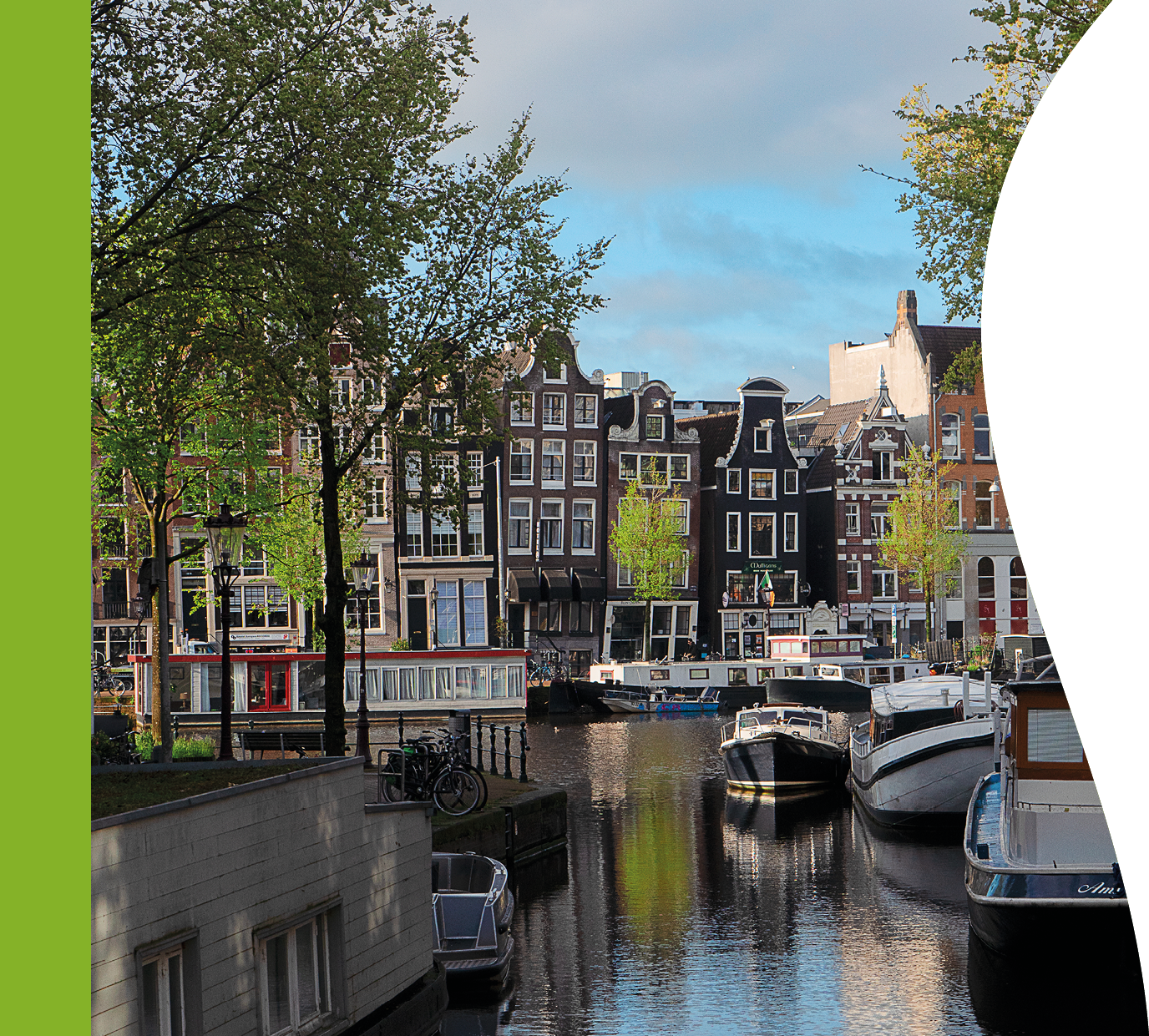 Facades of old historic Houses, bridges and trees over canal water, Amsterdam, Netherlands