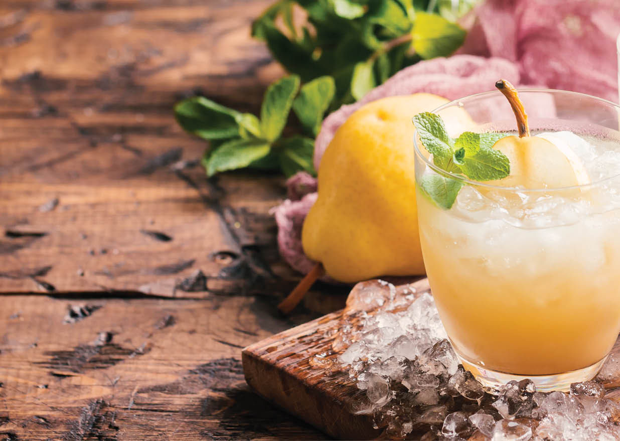 Pear Juice with ice, fresh fruits and mint on vintage background