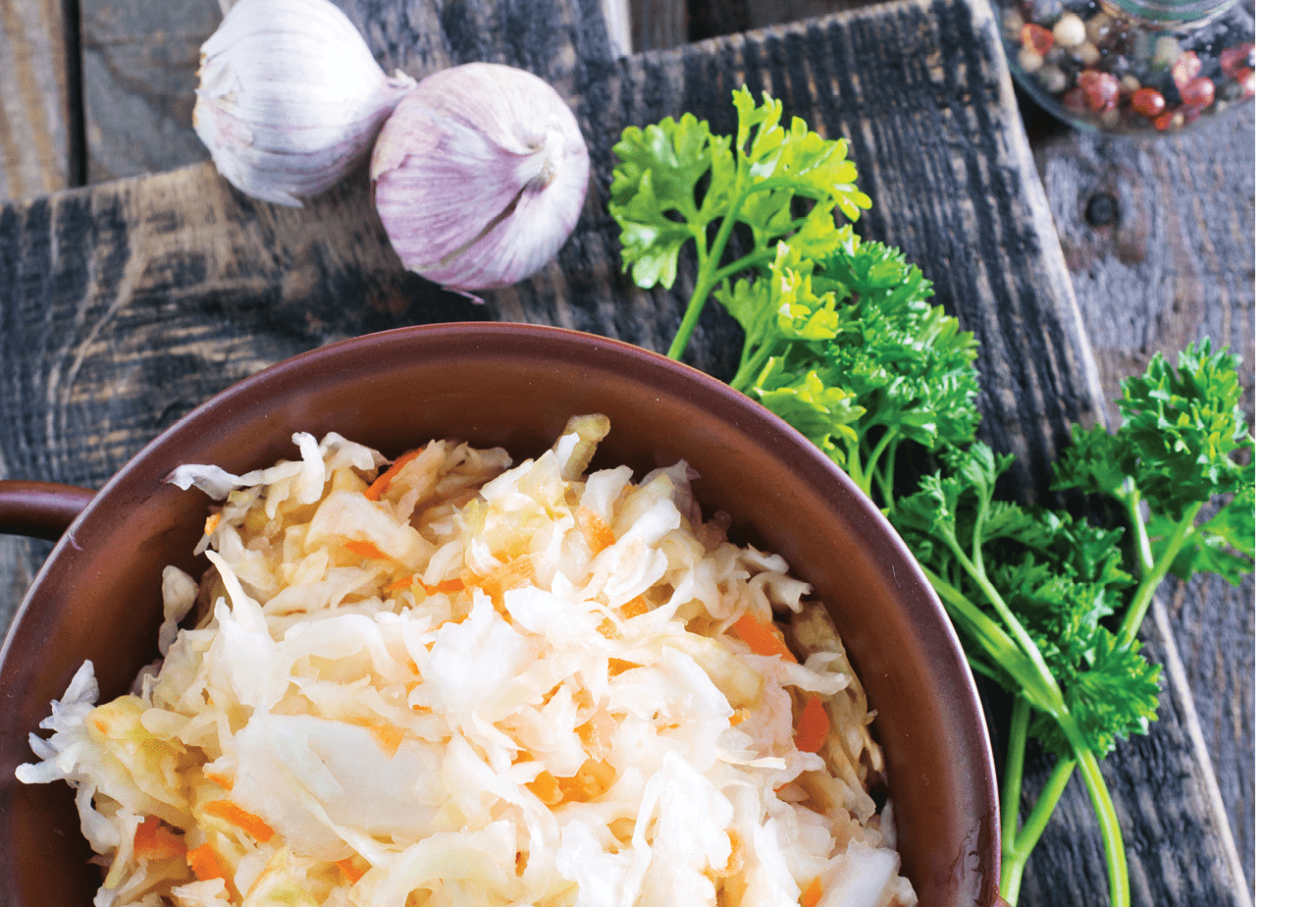 sauerkraut salad in the bowl and on a table