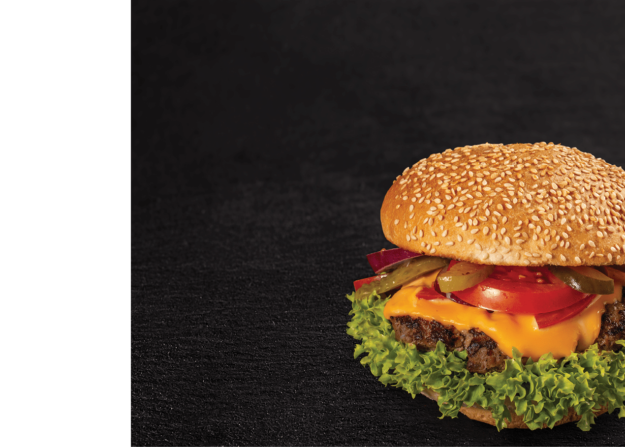 Delicious fresh hamburger on a black slate background