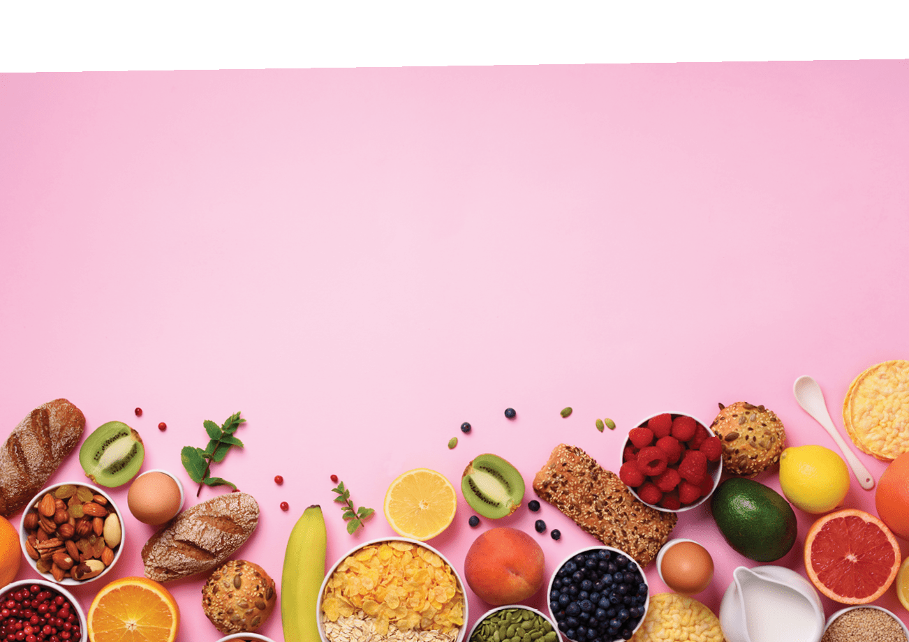 Healthy breakfast ingredients, food frame. Oat and corn flakes, eggs, nuts, fruits, berries, toast, milk, yogurt, orange, banana, peach on pink background. Top view, copy space. Flat lay.