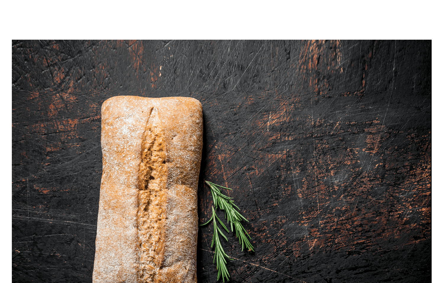 Bread ciabatta with rosemary. On dark rustic background