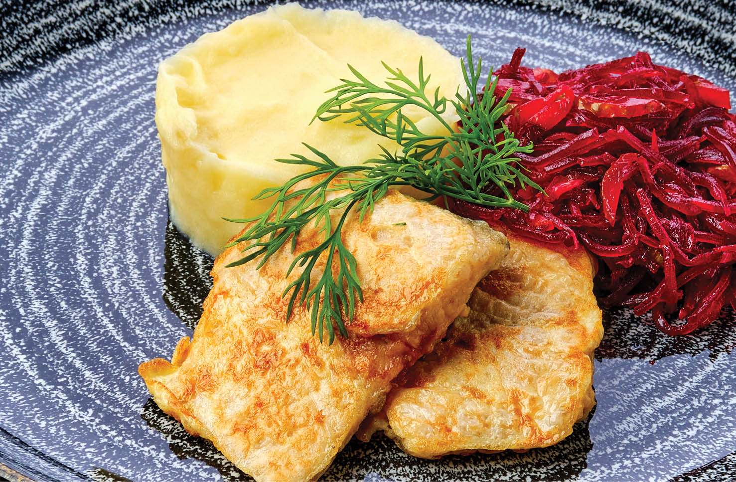 Fried hake in breading with mashed potato and roasted beetroot