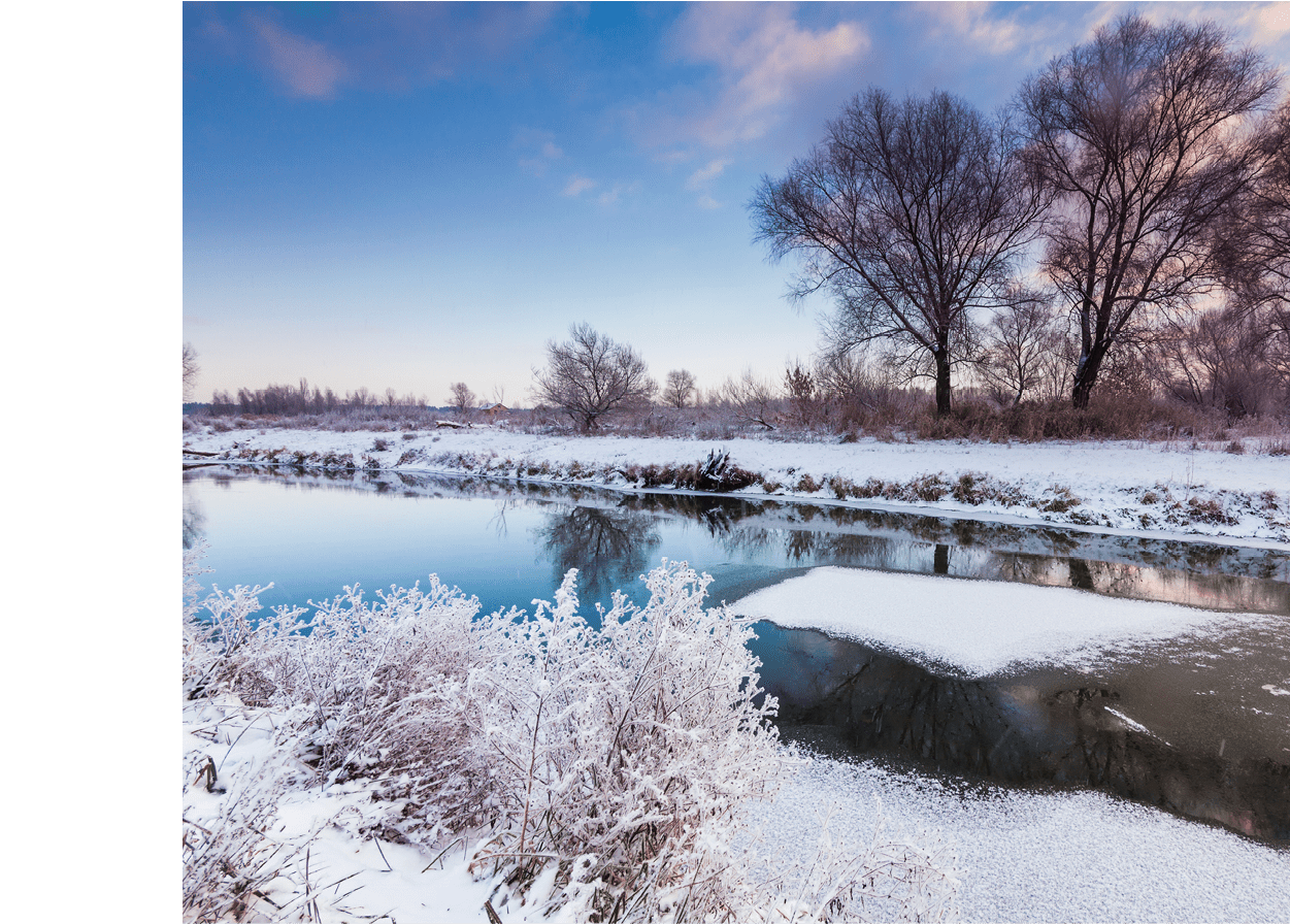 Dawn over the river in a frosty winter morning