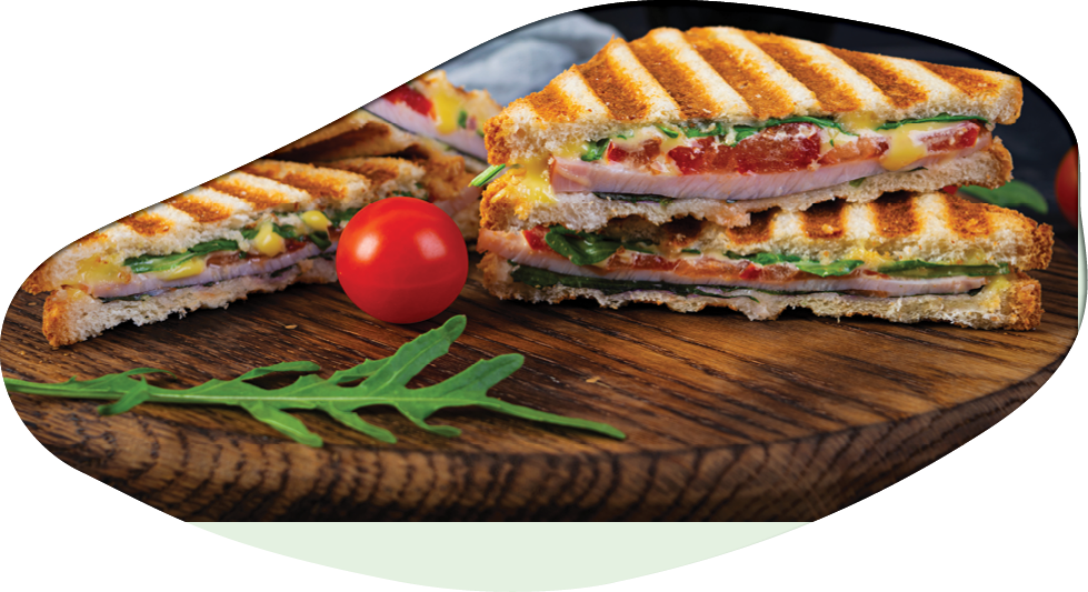 Sandwich with ham, cheese, mustard leaves, tomatoes and onion. Tasty club sandwiches