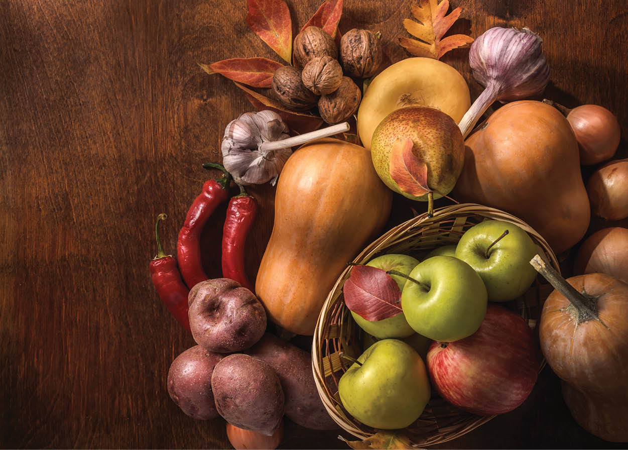 Fruits and vegetables on a dark wooden background in a rustic style