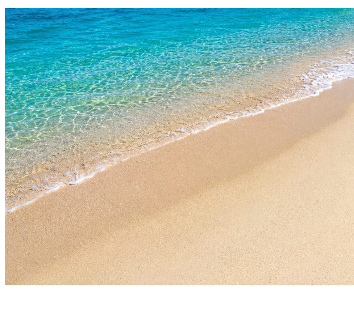 A beach with a wave crashing on the shore. Description generated by AI
