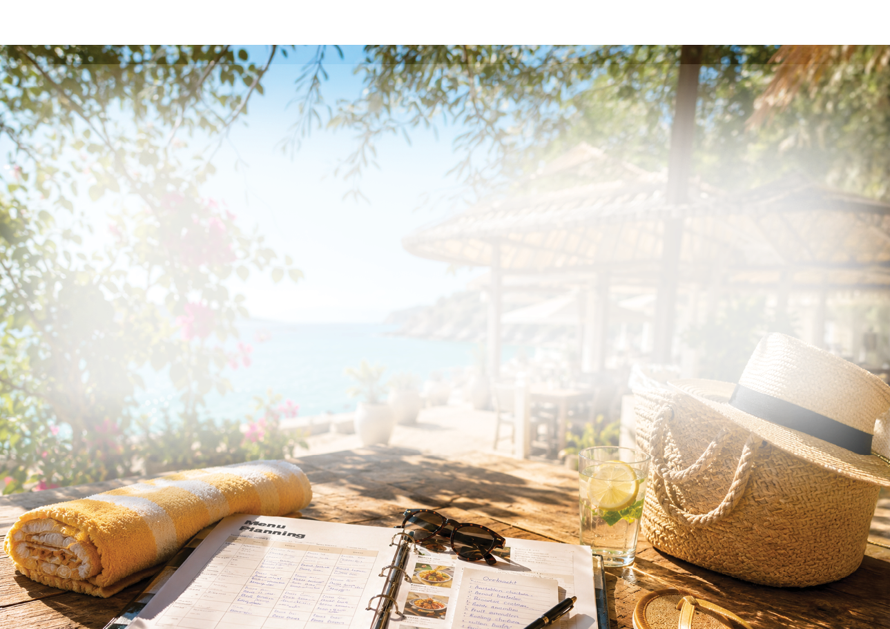 A notebook with writing on it sits on a table next to a hat. Description generated by AI
