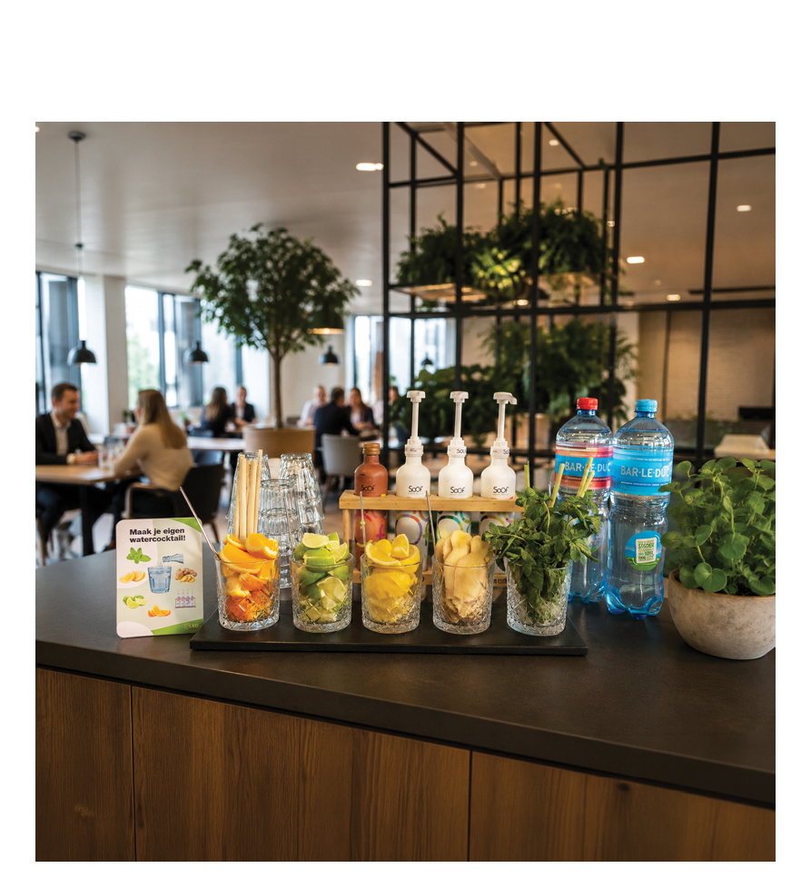 A wooden counter with a variety of drinks and condiments. Description generated by AI