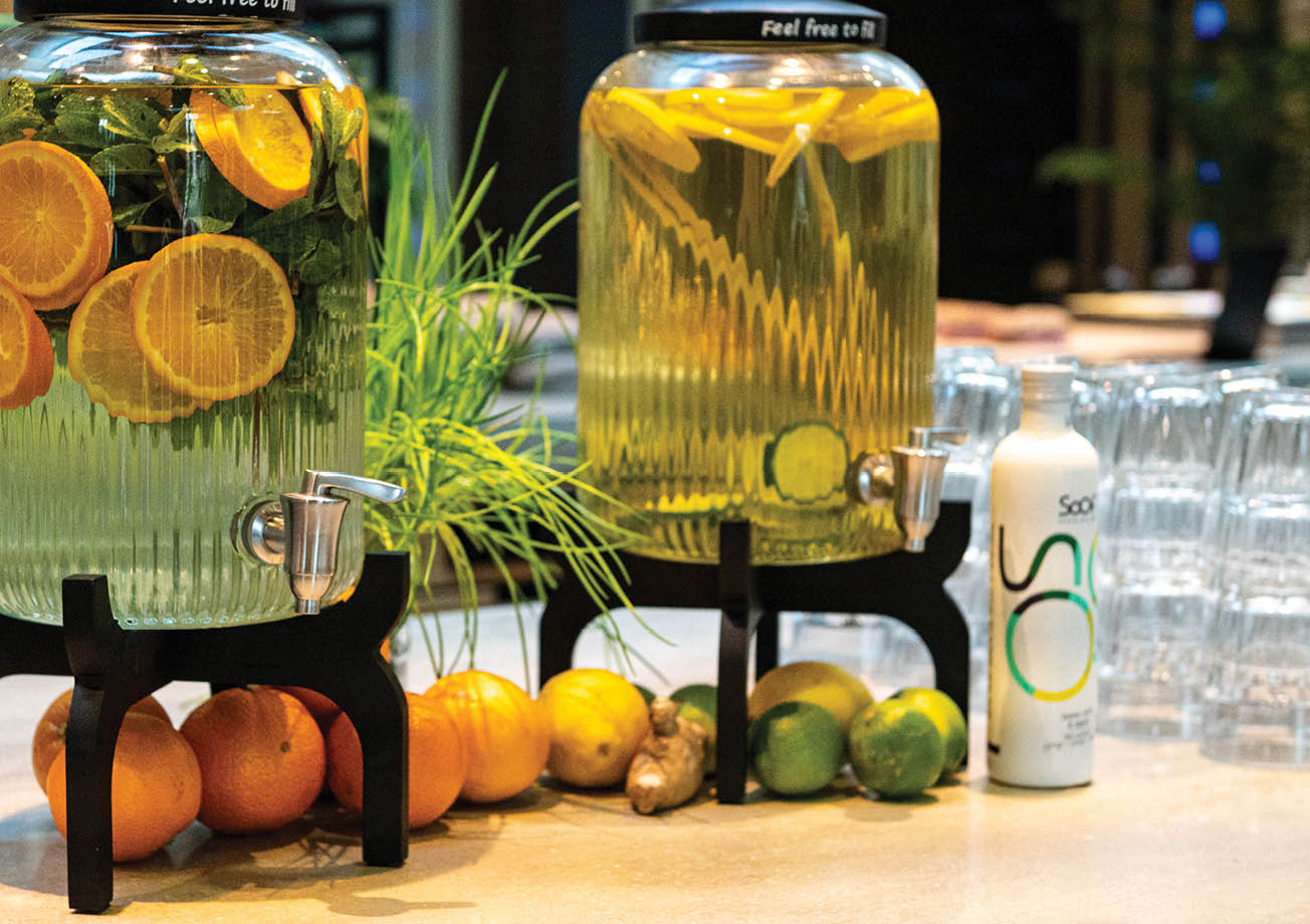 Two glass jars filled with fruit and vegetables. Description generated by AI