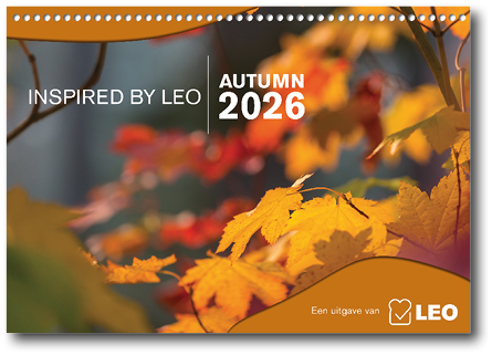 Bright orange and yellow autumn leaves are shown in close-up with blurred background foliage and text indicating “Inspired by Leo Autumn 2026." Description generated by AI