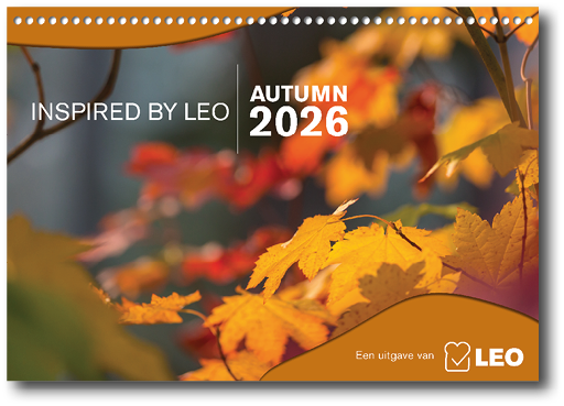 Bright orange and yellow autumn leaves are shown in close-up with blurred background foliage and text indicating “Inspired by Leo Autumn 2026." Description generated by AI