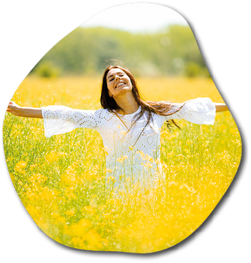 Pretty young woman in the rapeseed field