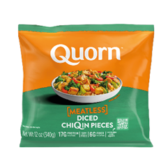 A package of Quorn meatless diced chicken pieces with an orange and green design and a bowl of cooked diced chicken with vegetables on the front. Description generated by AI