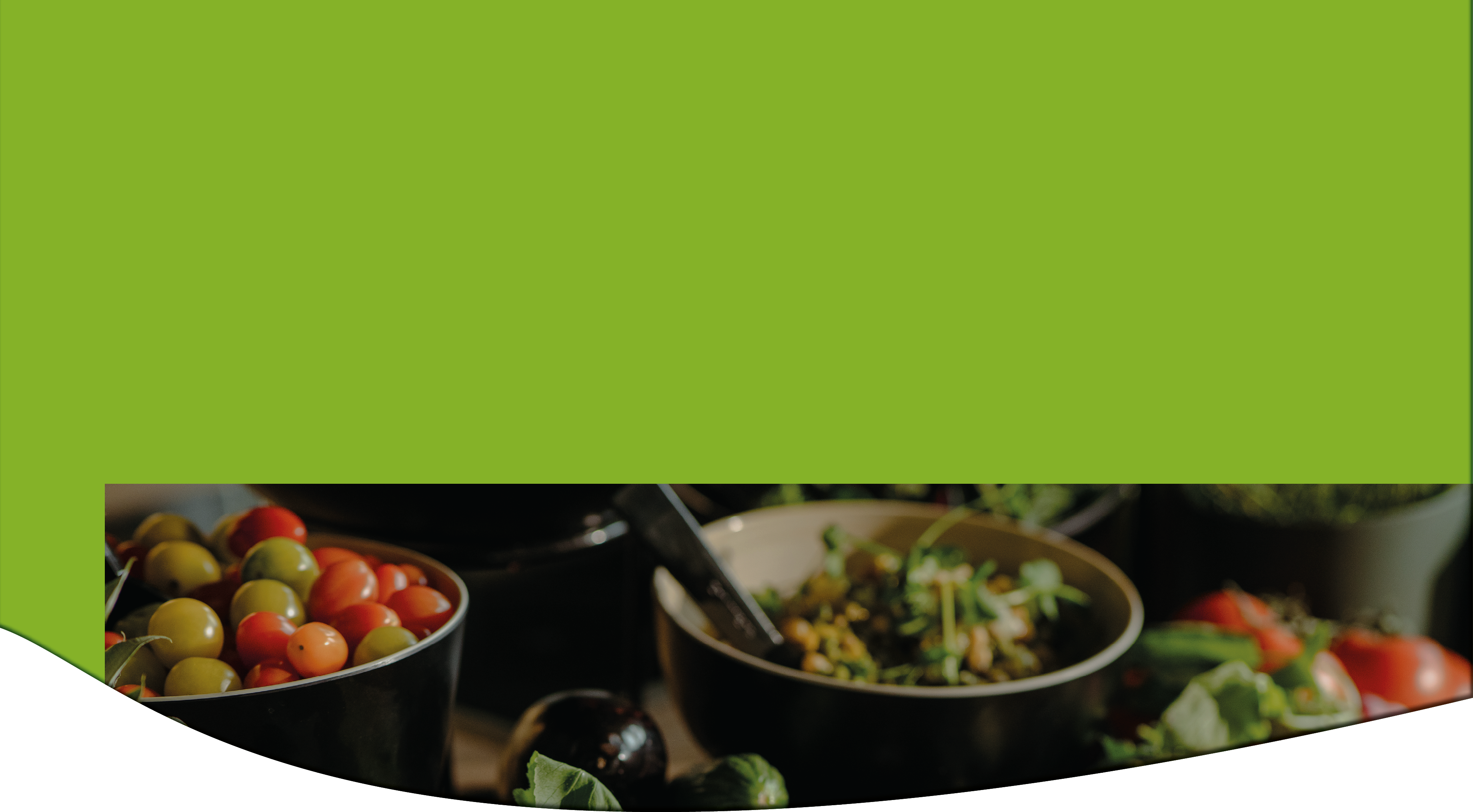 A close-up of bowls filled with colorful cherry tomatoes and a mixed salad with fresh vegetables in a dimly lit setting. Description generated by AI