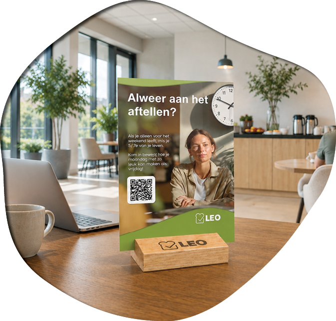 A wooden table with a laptop and a sign on it. Description generated by AI