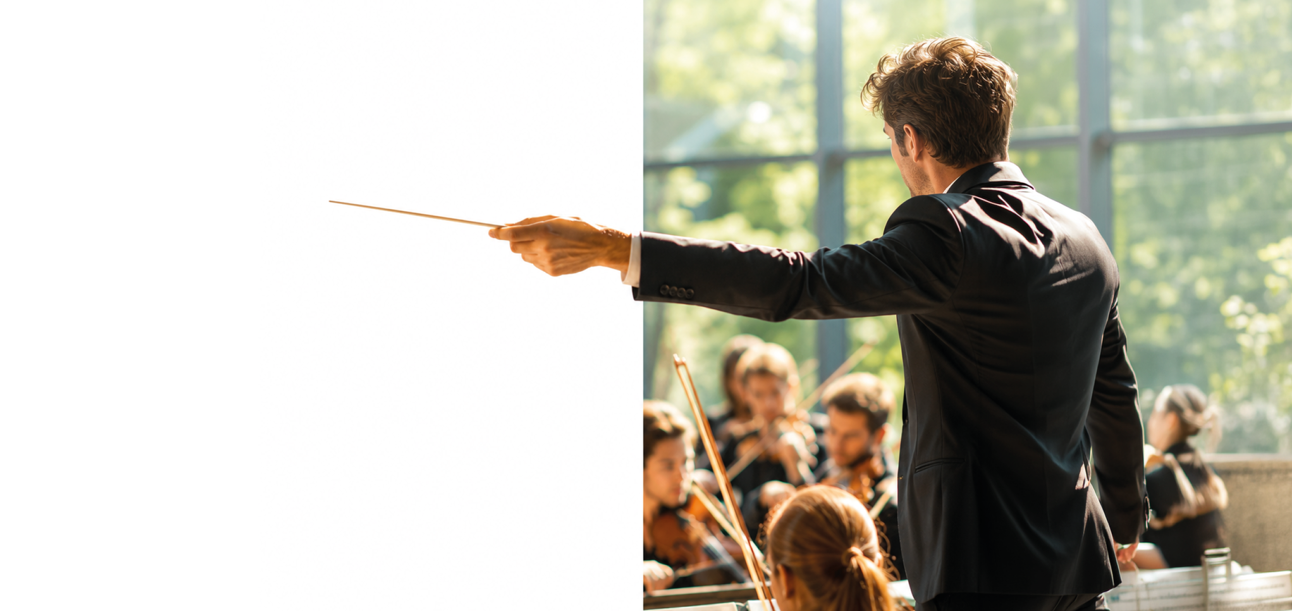 A man in a black suit and tie is conducting an orchestra. Description generated by AI