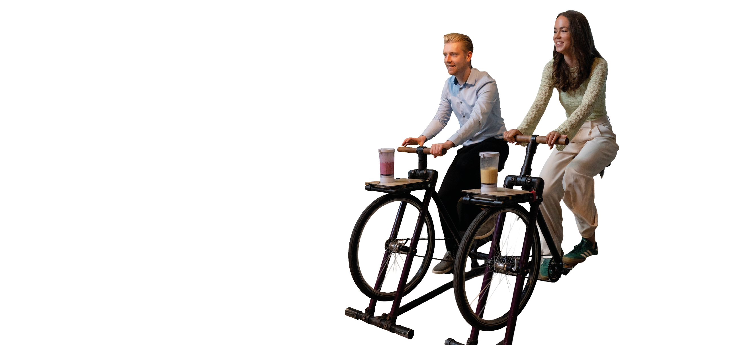 A man and woman are riding exercise bikes. Description generated by AI