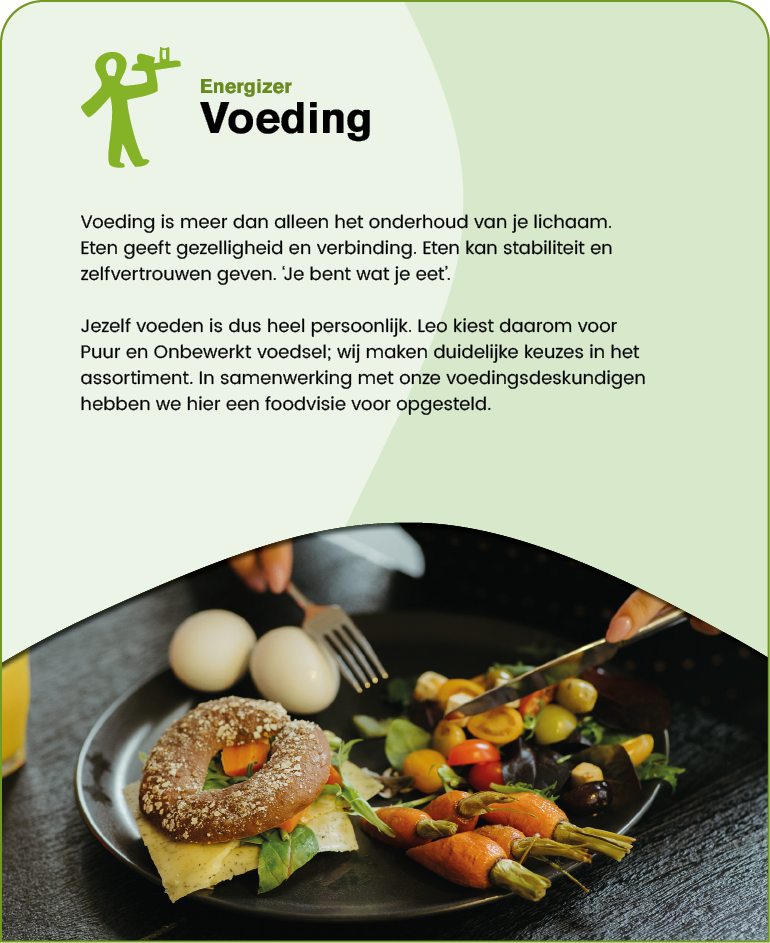 A person is cutting a colorful vegetable dish on a black plate with a fork and knife next to a sandwich with cheese and a seeded bun. Description generated by AI