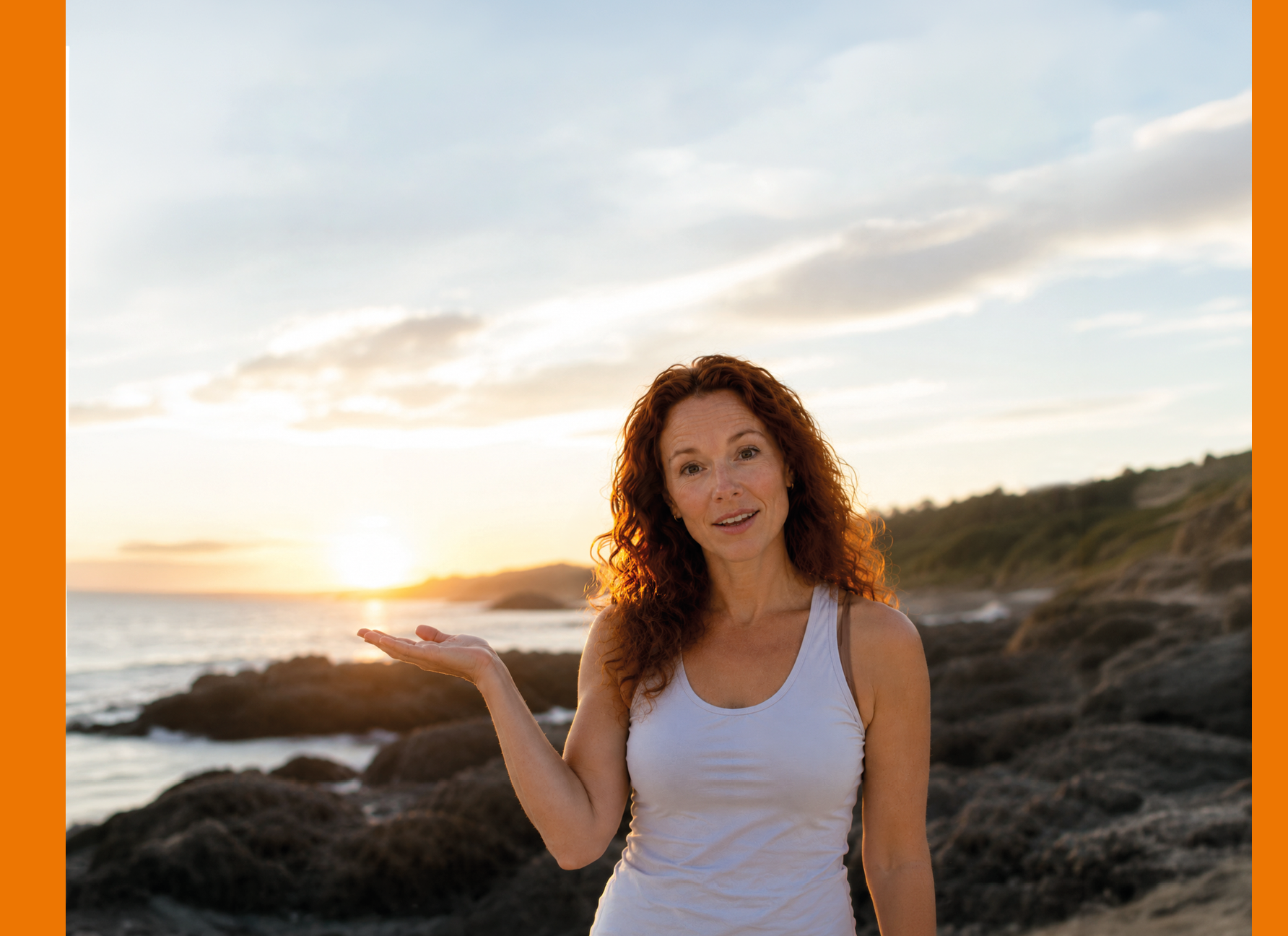 A woman with red hair and a white tank top is standing on a beach. Description generated by AI