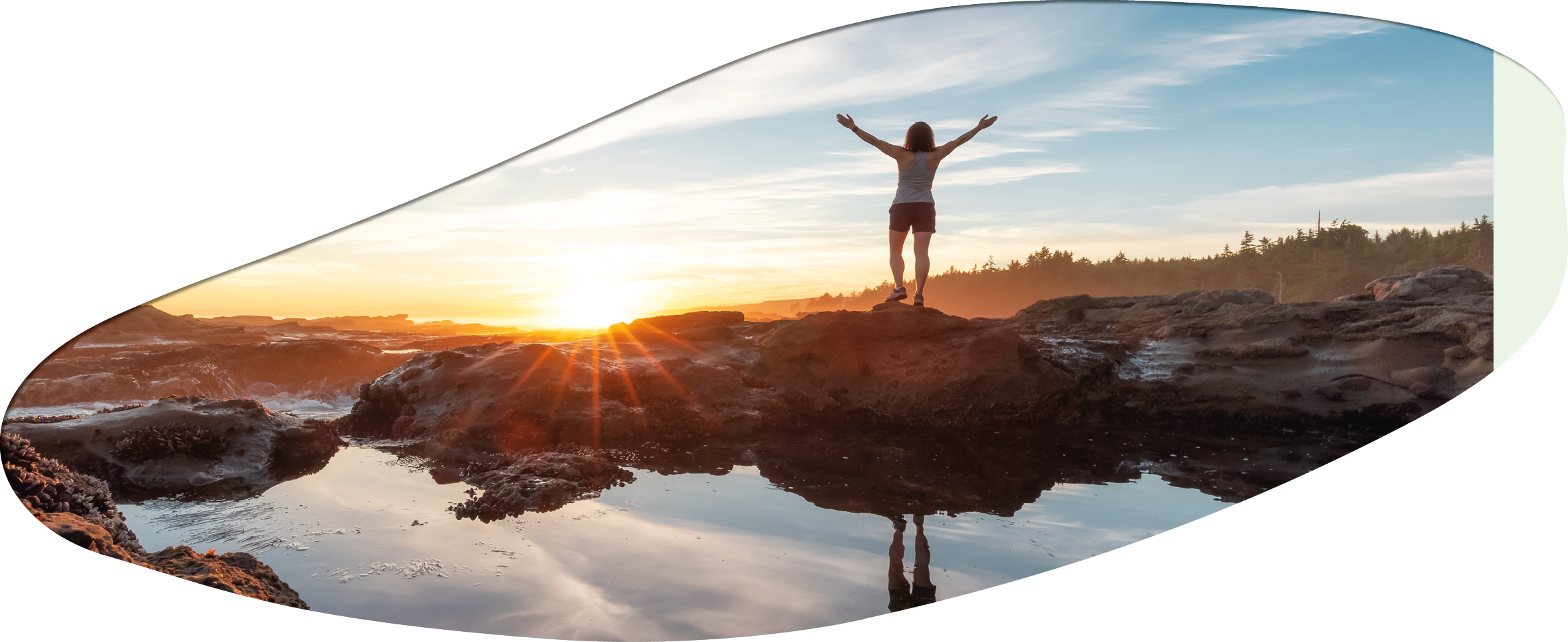 Adventurous Woman Hiking at Botanical Beach on the West Coast of Pacific Ocean. Summer Sunny Sunset. Canadian Nature Landscape Background. Port Renfrew near Victoria, Vancouver Island, BC, Canada.
